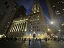 People walk past the New York Stock Exchange on November 26 2024. (AP Photo/Peter Morgan, File)